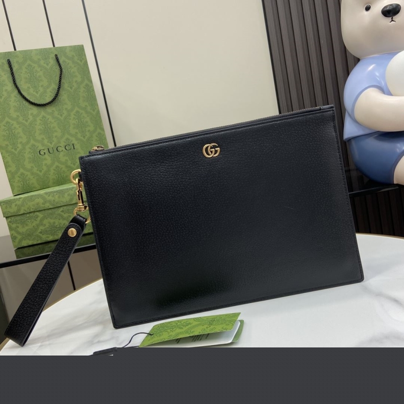 G*u*i clutch bags